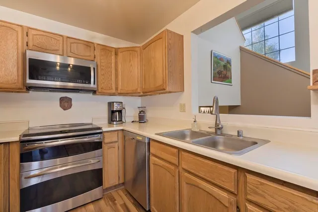a kitchen with a sink and cabinets
