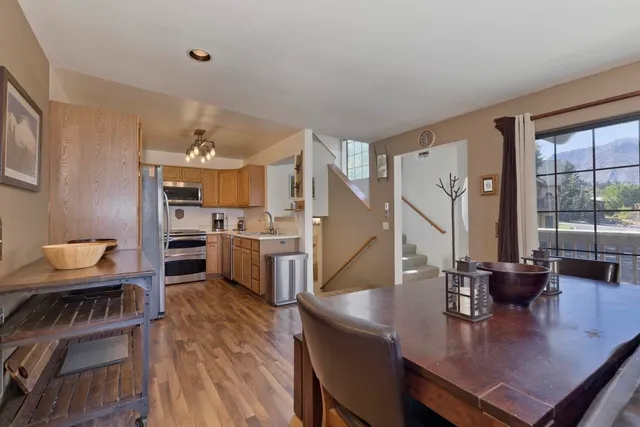 a view of a dining room with furniture and wooden floor