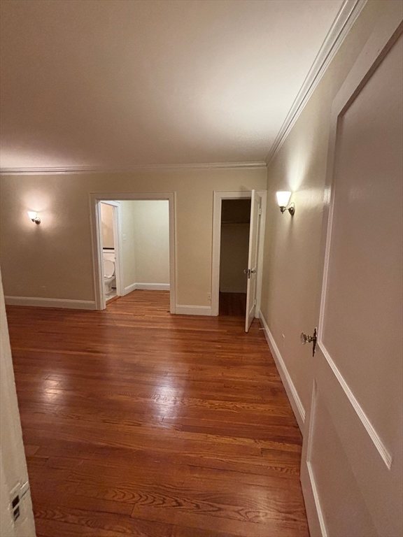 50 Broadway, Unit 47 Beverly, MA 01915 - Photo 4 of 10 a view of a hallway with wooden floor