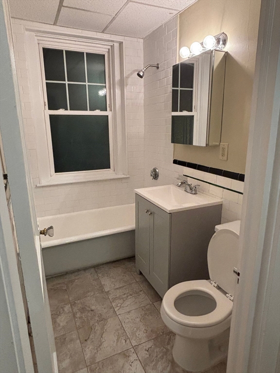 50 Broadway, Unit 47 Beverly, MA 01915 - Photo 8 of 10 a bathroom with a sink toilet and shower