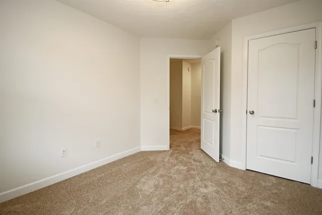 an empty room with closet area