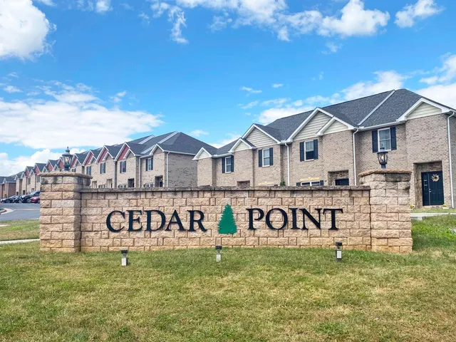 a view of a house with garden and yard