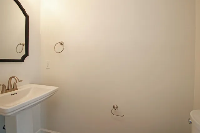 a bathroom with a sink and mirror