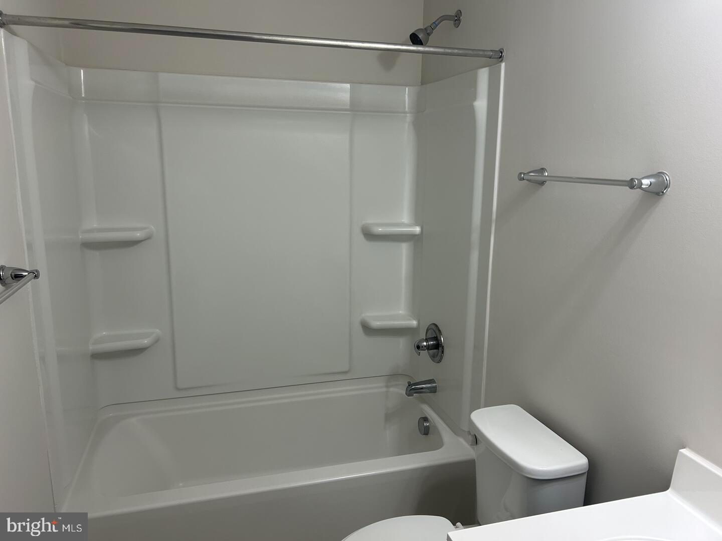 224 Lady Bug Drive Dover, DE 19901 - Photo 13 of 13 a bathroom with a bathtub and a toilet