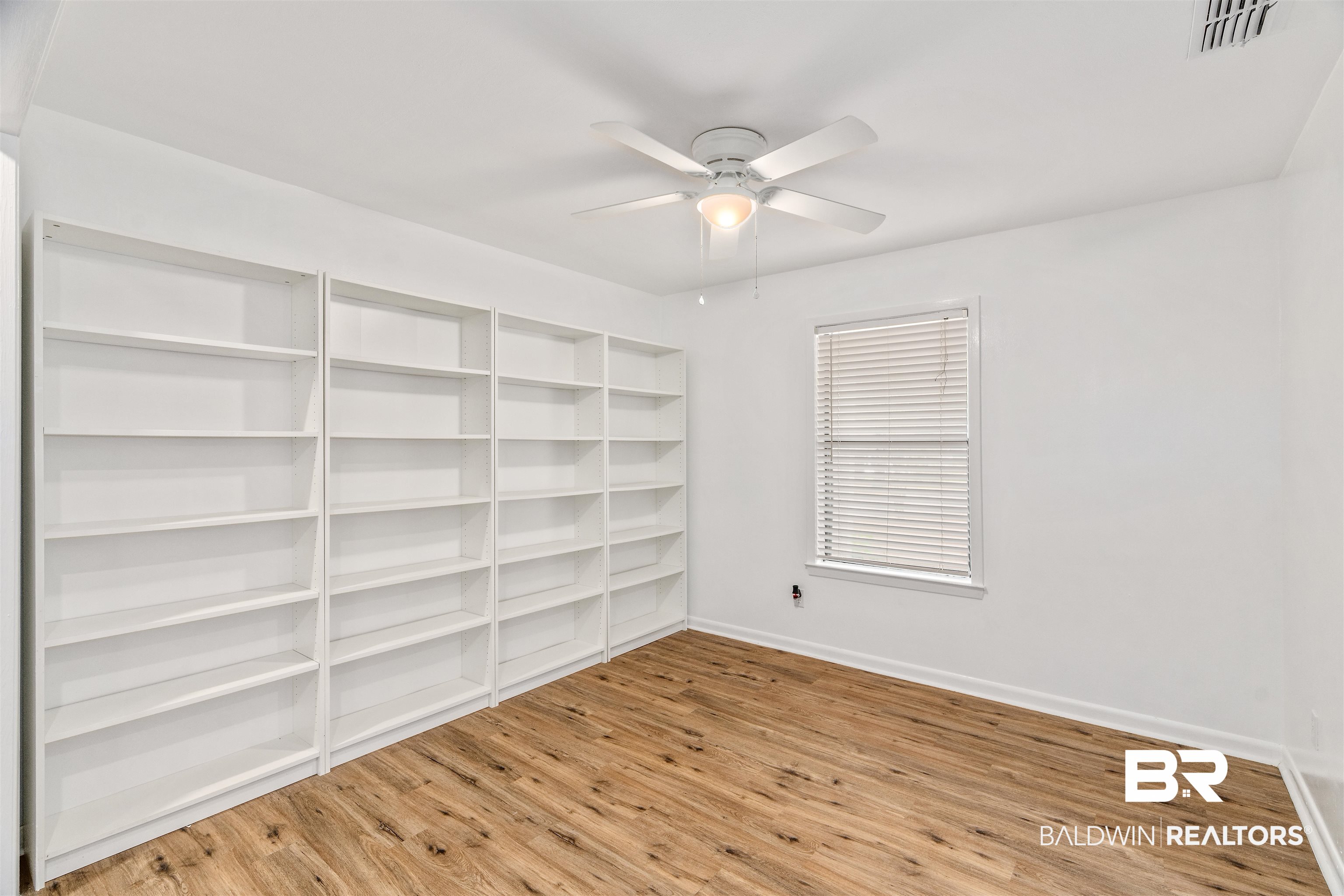 159 Montclair Loop Daphne, AL 36526 - Photo 3 of 18 Spare room with light wood-style flooring and a ceiling fan