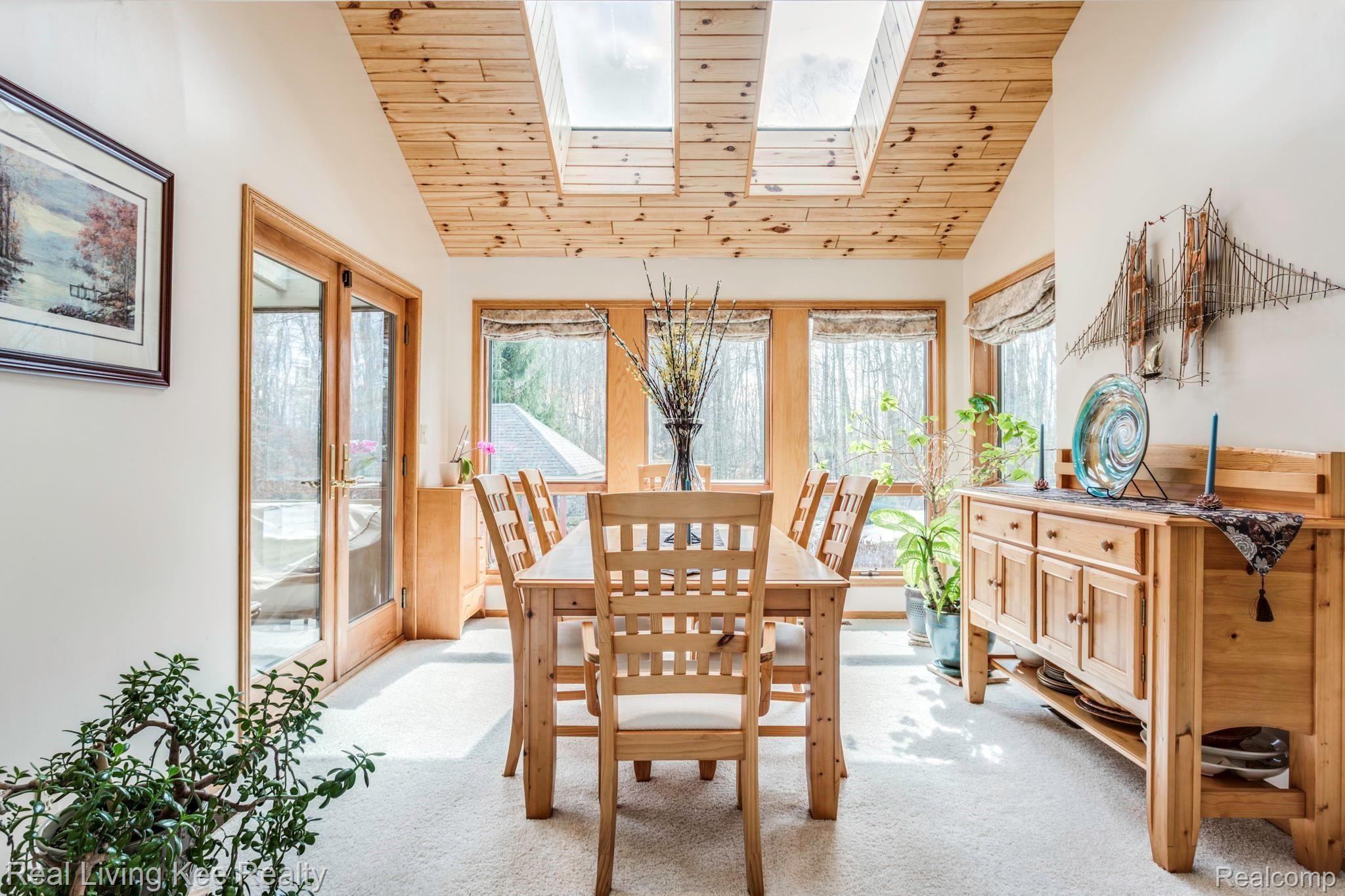 5775 McIntyre Road North Street, MI 48049 - Photo 14 of 65 5775 McIntyre Rd. diinng room with knotty pine ceiling and skylights.JPG