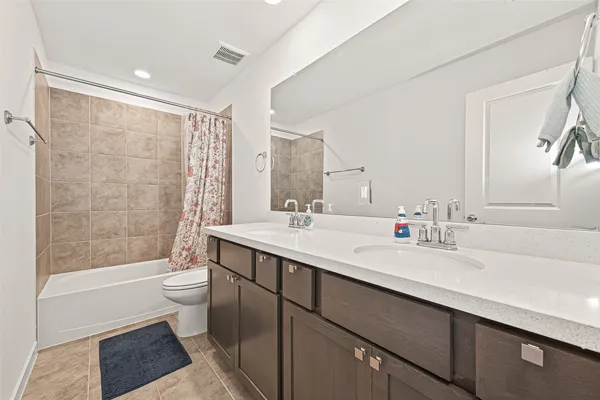 a bathroom with a sink toilet and vanity