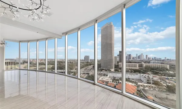 a view of a room with wooden floor and balcony