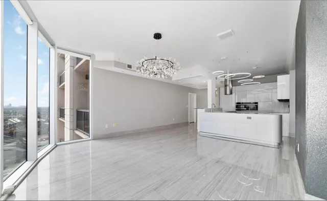 a view of a room with wooden floor and balcony