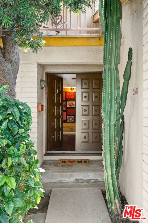 5101 Lindblade Drive Culver City, CA 90230 - Photo 11 of 11 a view of yellow house with front door