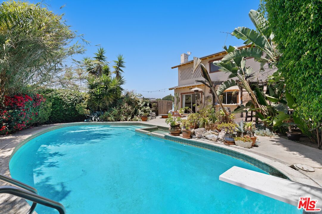 5101 Lindblade Drive Culver City, CA 90230 - Photo 2 of 11 a view of a swimming pool with a yard