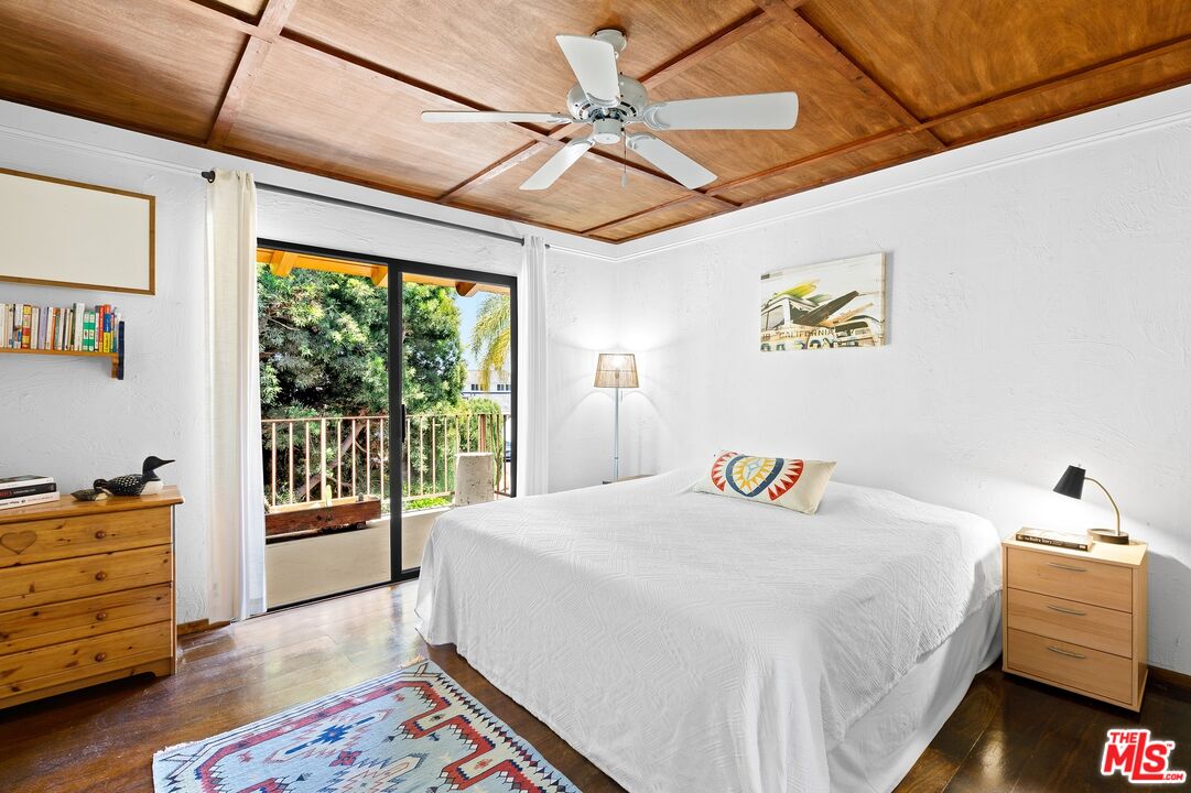 5101 Lindblade Drive Culver City, CA 90230 - Photo 6 of 11 a bedroom with a bed and a window