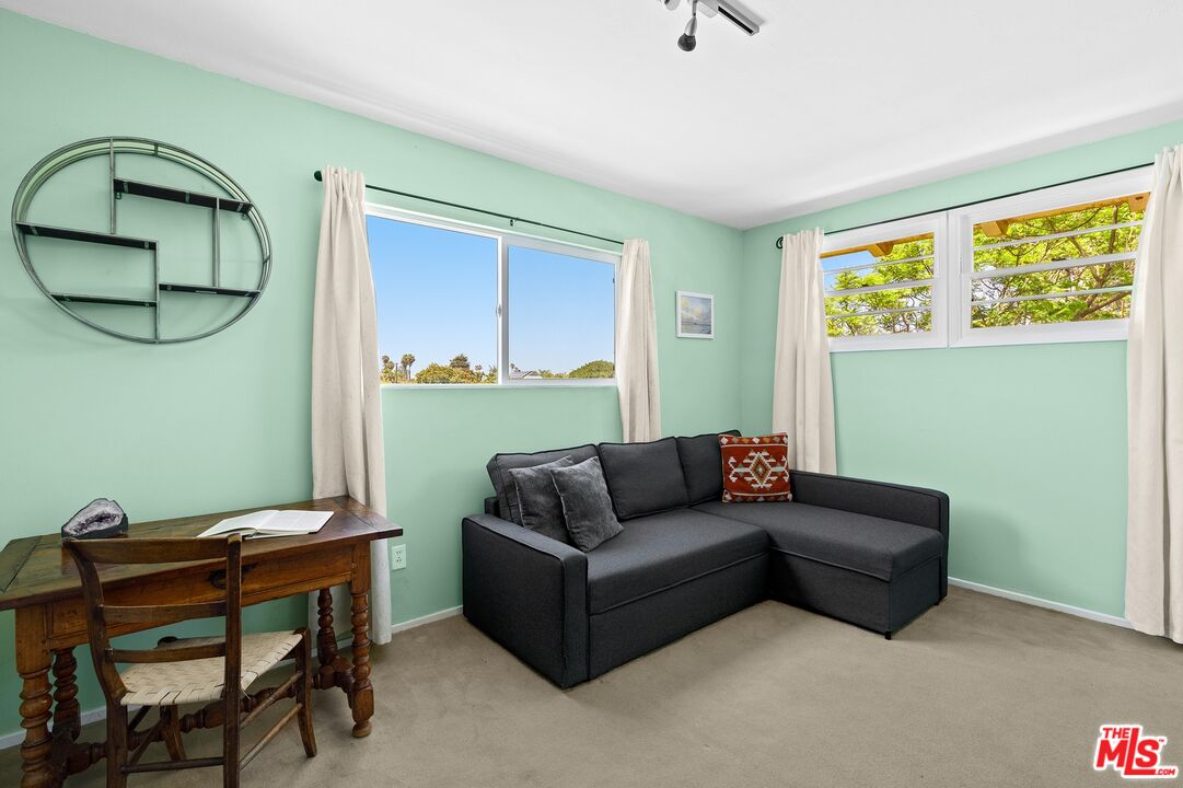 5101 Lindblade Drive Culver City, CA 90230 - Photo 7 of 11 a living room with furniture and a window