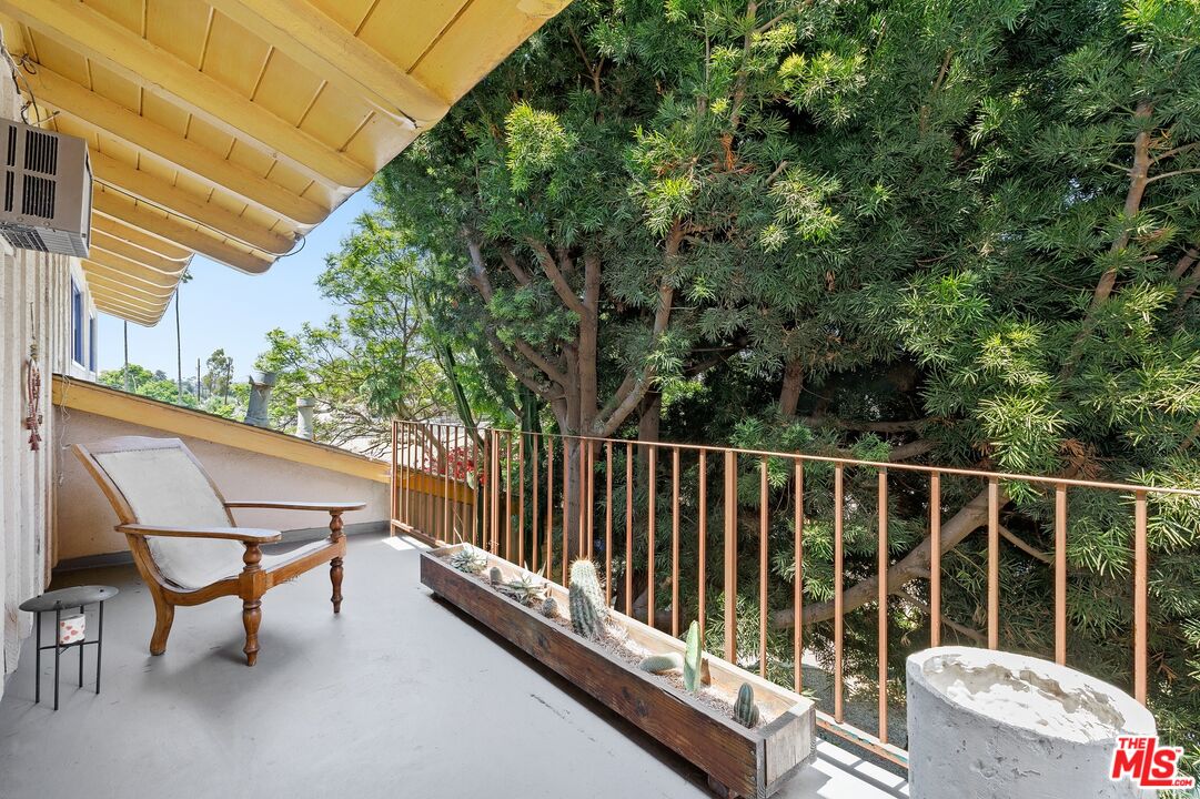 5101 Lindblade Drive Culver City, CA 90230 - Photo 10 of 11 a view of balcony with wooden floor and fence