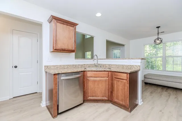 a kitchen with granite countertop kitchen island white cabinets and a granite counter tops
