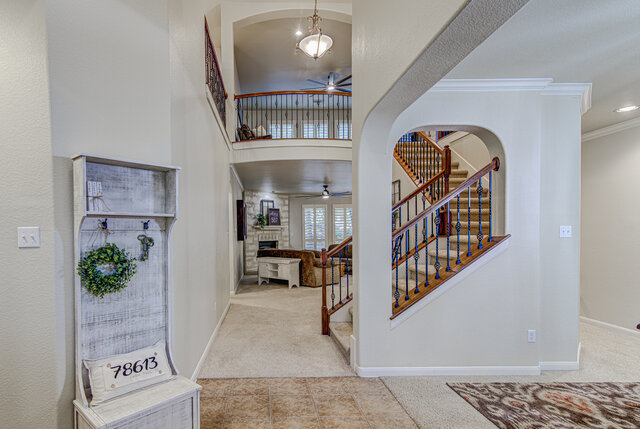 507 Rummel Ranch Run Cedar Park, TX 78613 - Photo 13 of 39 A grand entrance welcomes with a dual-level layout and an elegant staircase.