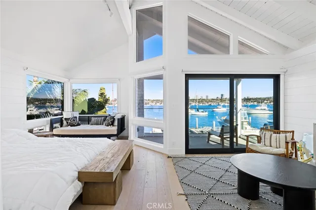 a living room with furniture and large windows