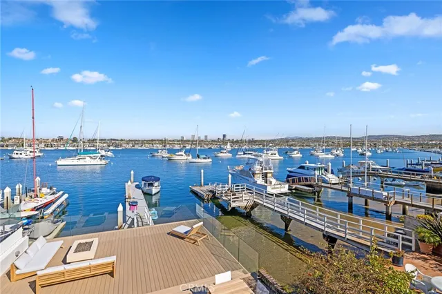 a view of a terrace with lawn chairs