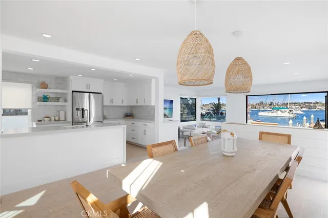 a large kitchen with a table and chairs