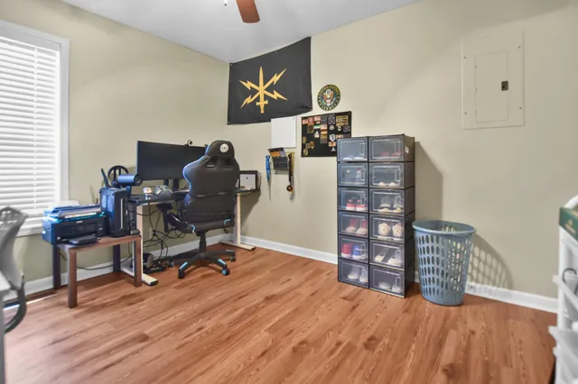 a workspace with furniture and wooden floor