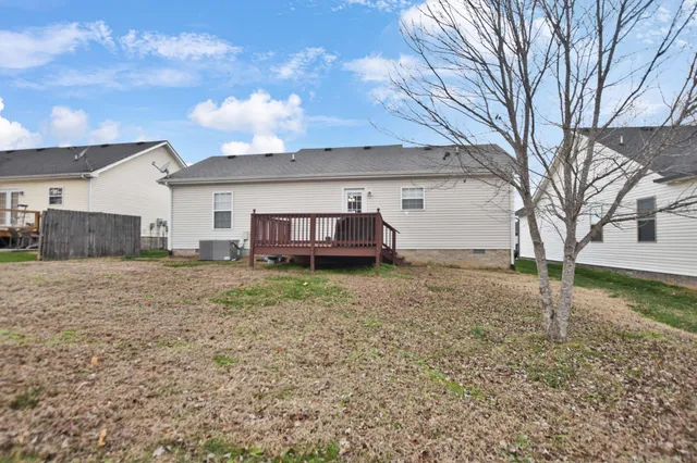 a view of a house with a back yard