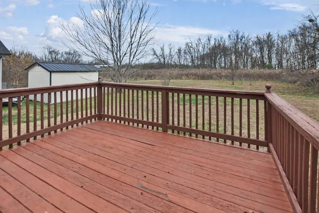 a view of a house with a back yard