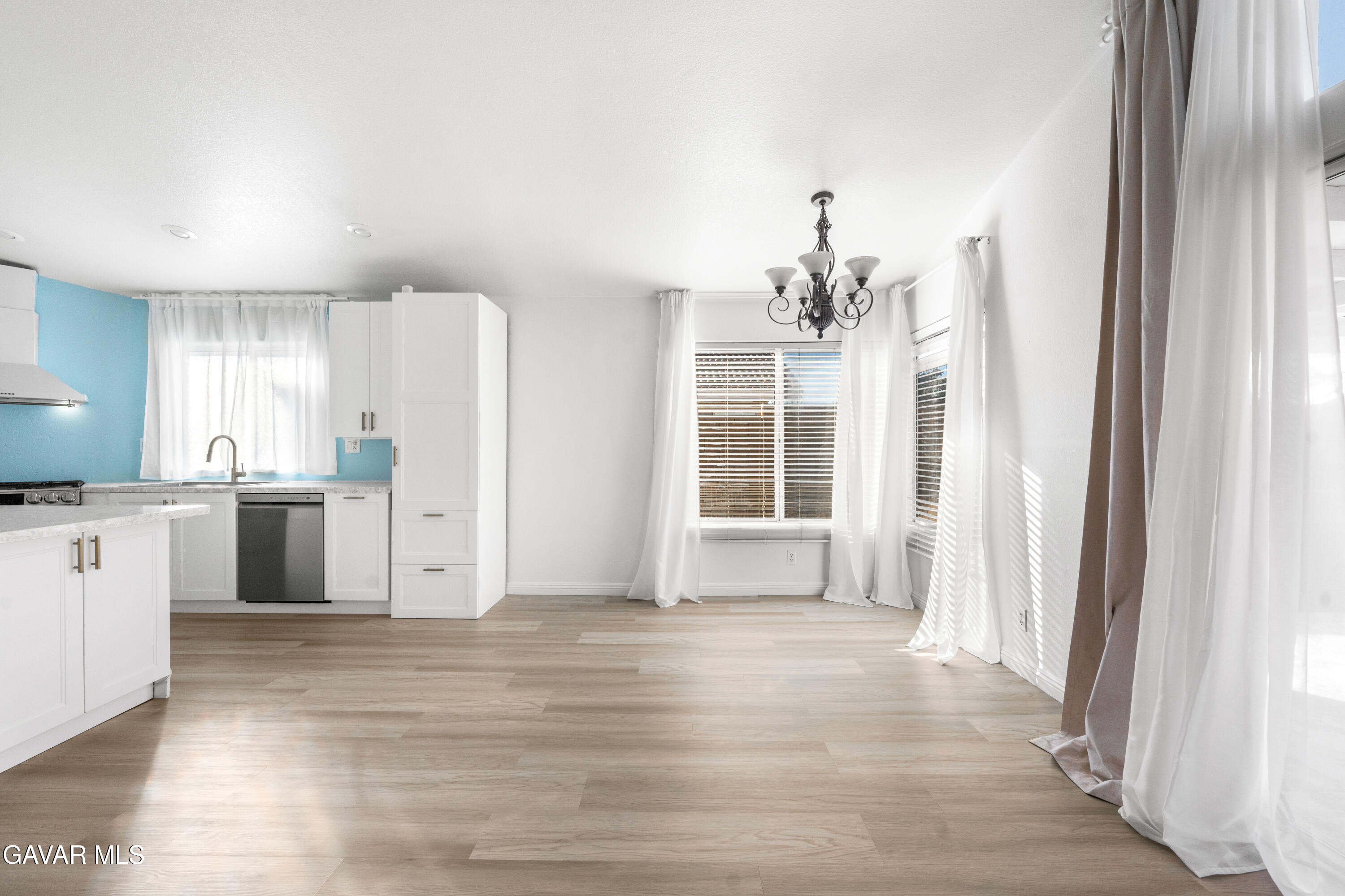 1639 East Kettering Street Lancaster, CA 93535 - Photo 17 of 35 a view of a kitchen with a sink and dishwasher kitchen view