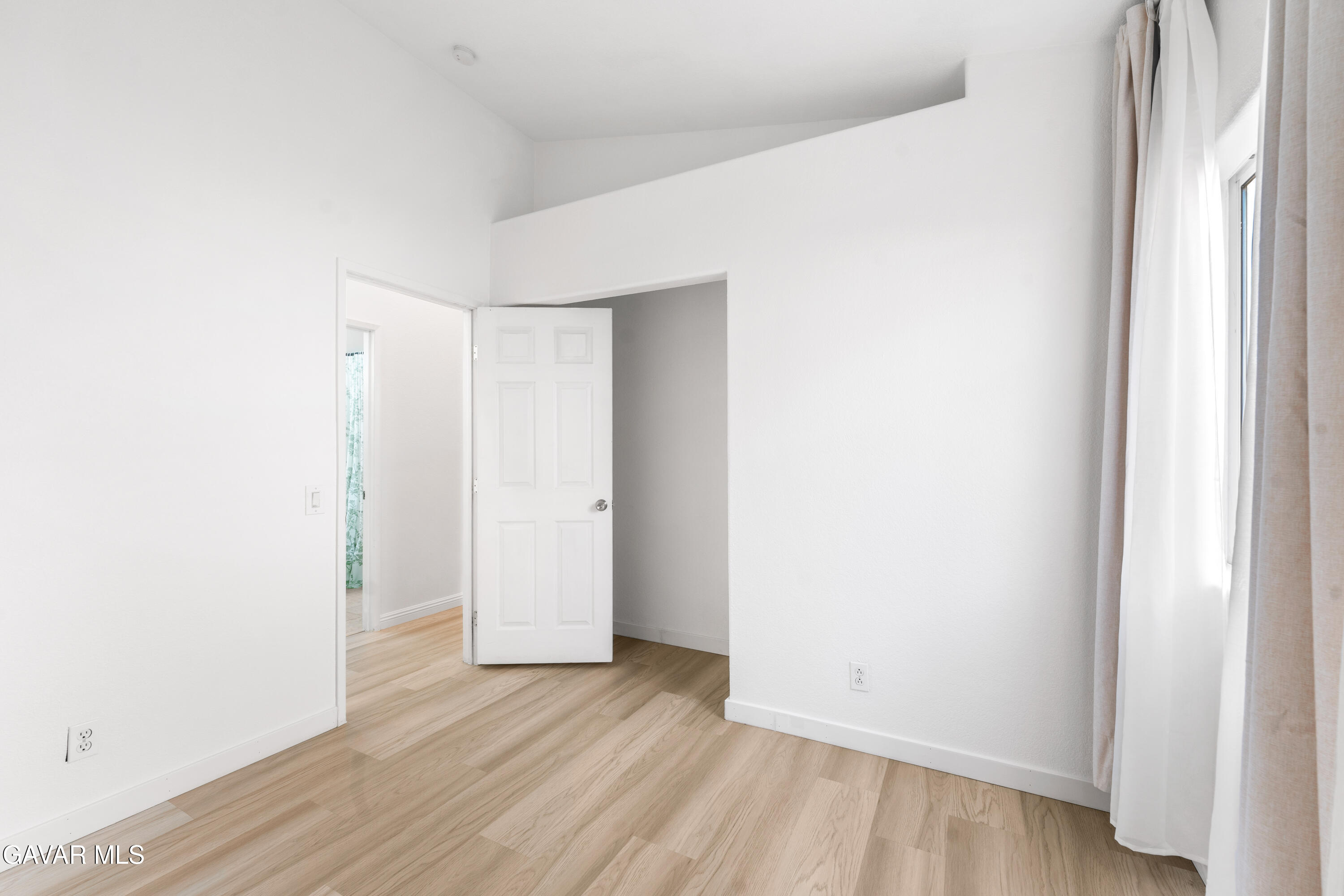 1639 East Kettering Street Lancaster, CA 93535 - Photo 20 of 35 a view of an empty room with wooden floor