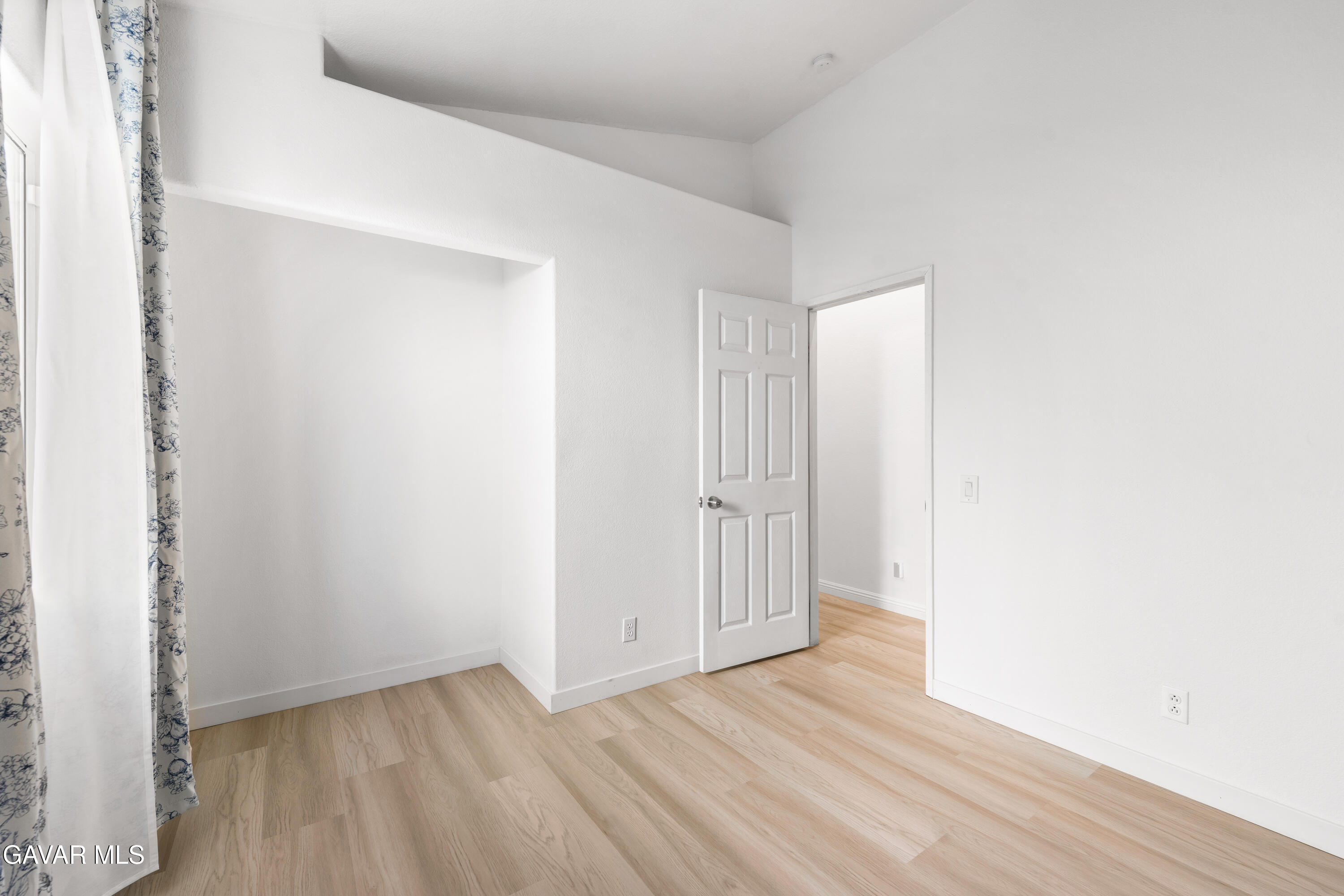 1639 East Kettering Street Lancaster, CA 93535 - Photo 22 of 35 a view of an empty room with wooden floor