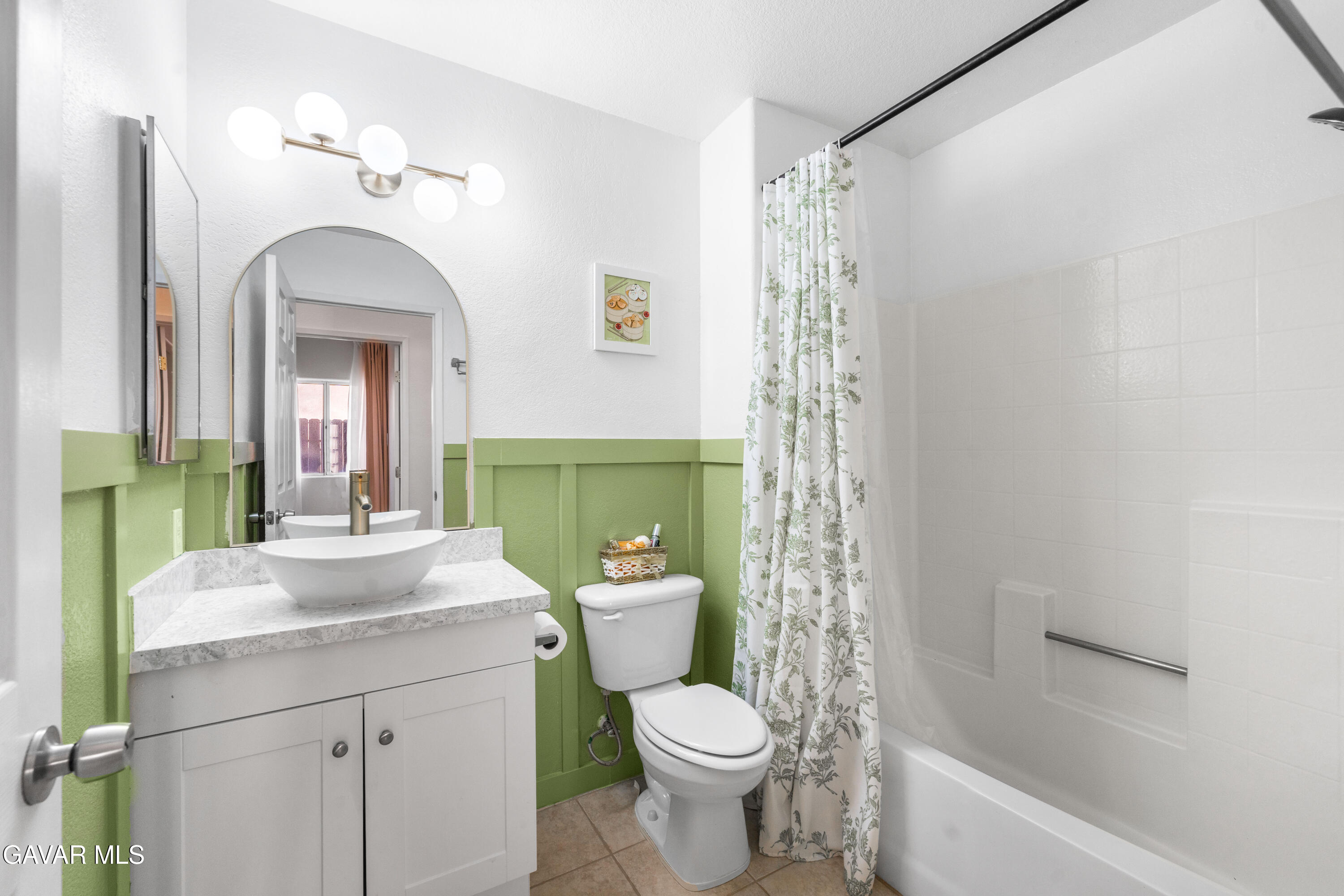 1639 East Kettering Street Lancaster, CA 93535 - Photo 23 of 35 a bathroom with a sink a toilet and shower