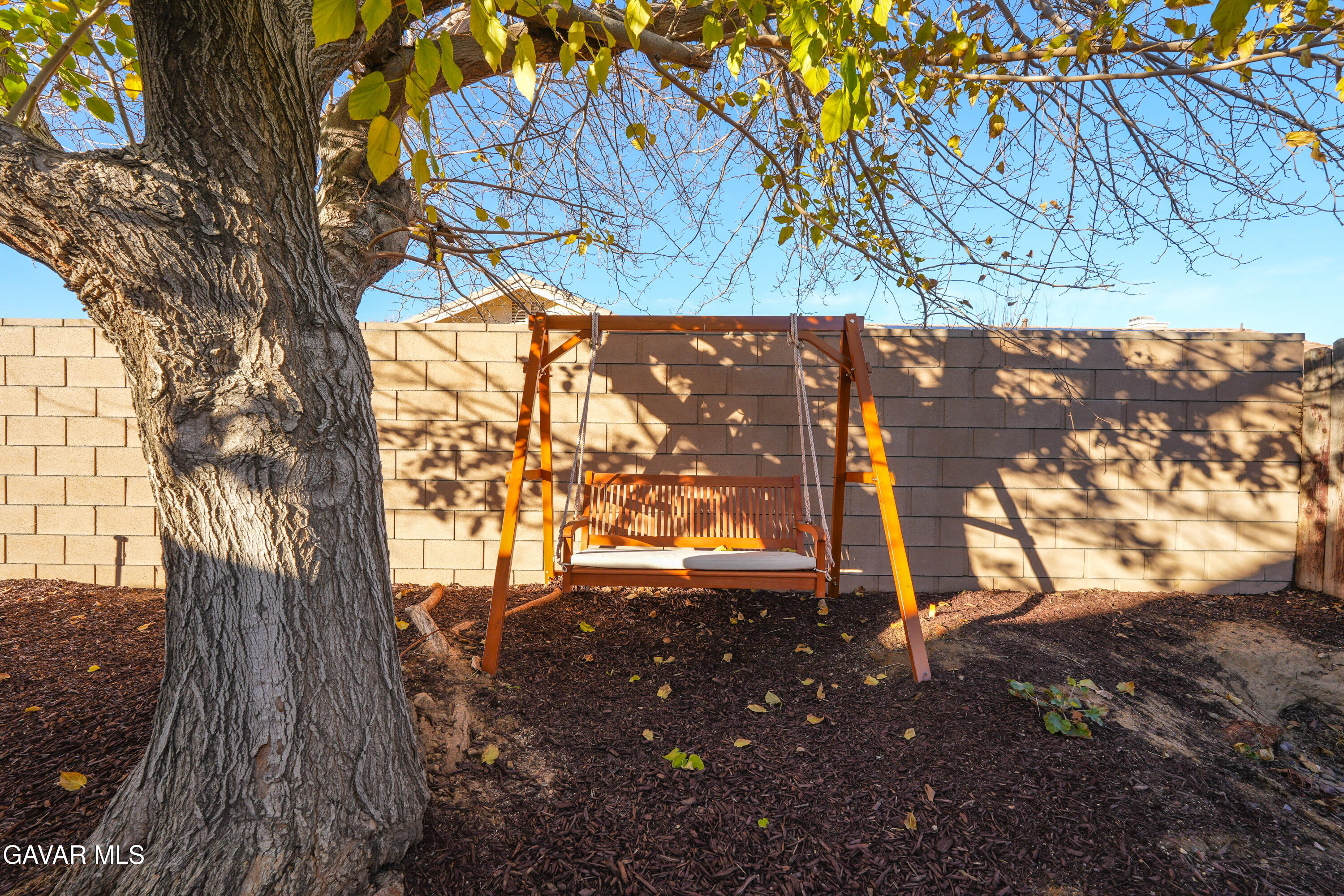 1639 East Kettering Street Lancaster, CA 93535 - Photo 30 of 35 a view of a yard with an tree
