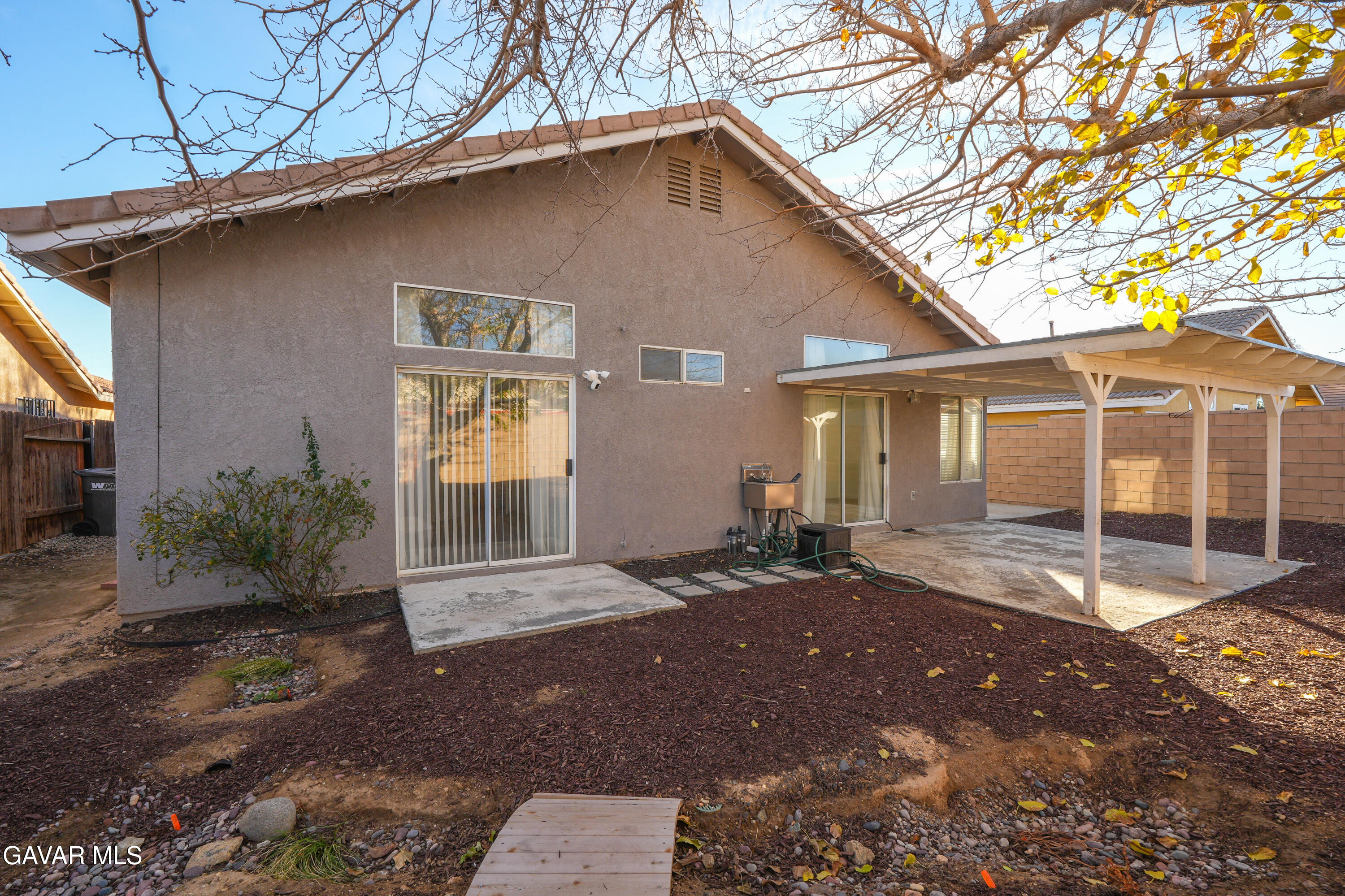 1639 East Kettering Street Lancaster, CA 93535 - Photo 31 of 35 a backyard of a house with yard and outdoor seating