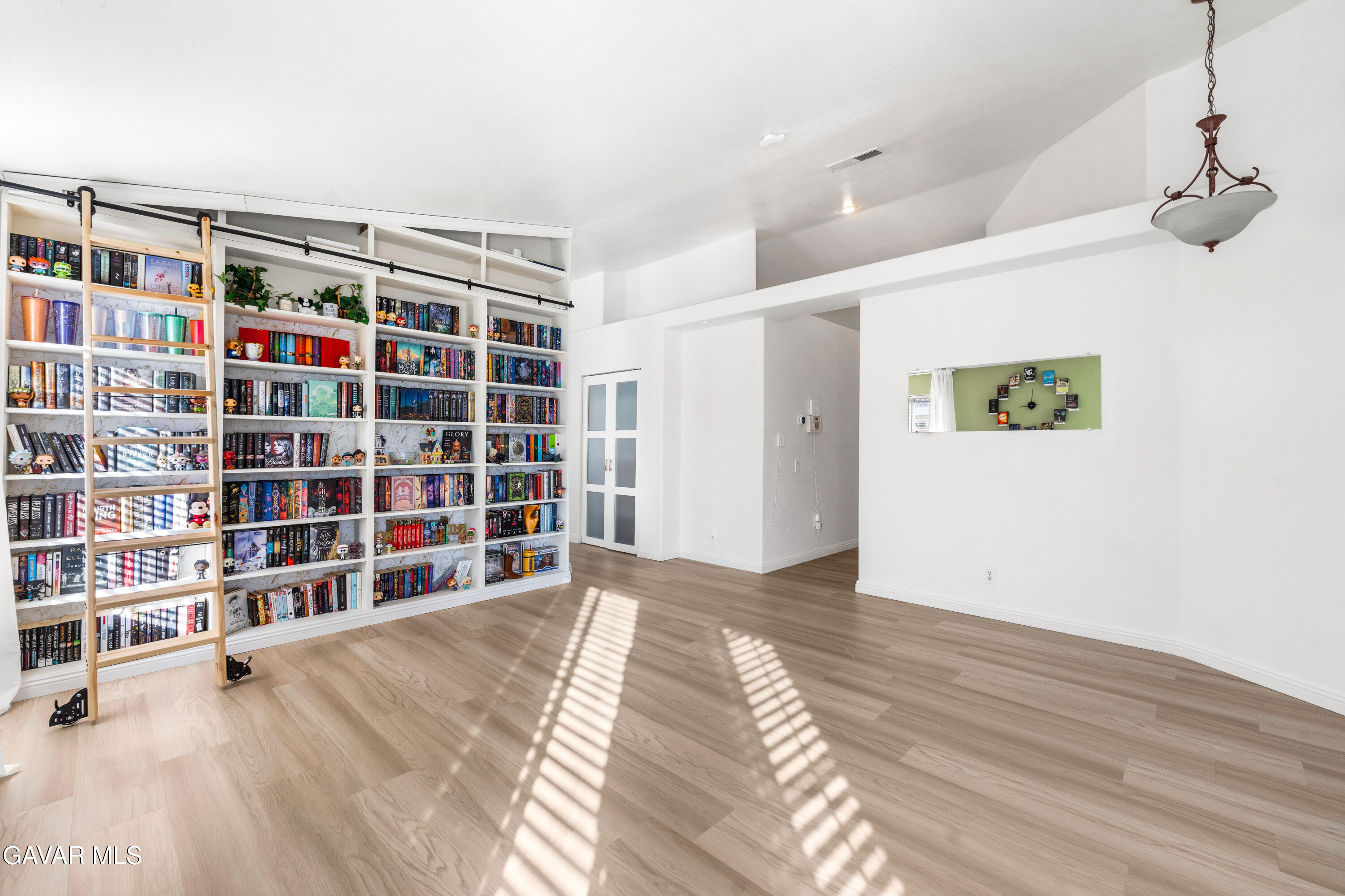 1639 East Kettering Street Lancaster, CA 93535 - Photo 8 of 35 a view of an empty room with a empty shelves
