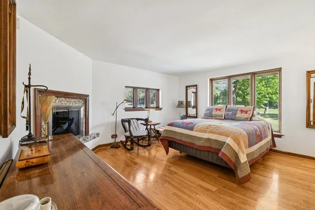 a dining room with furniture and large windows