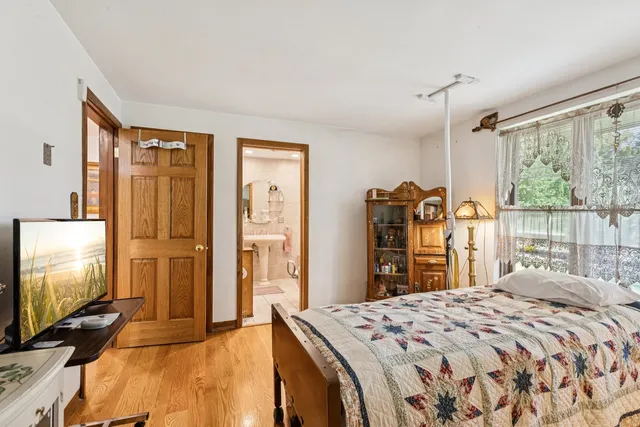 a bathroom with a sink mirror and toilet