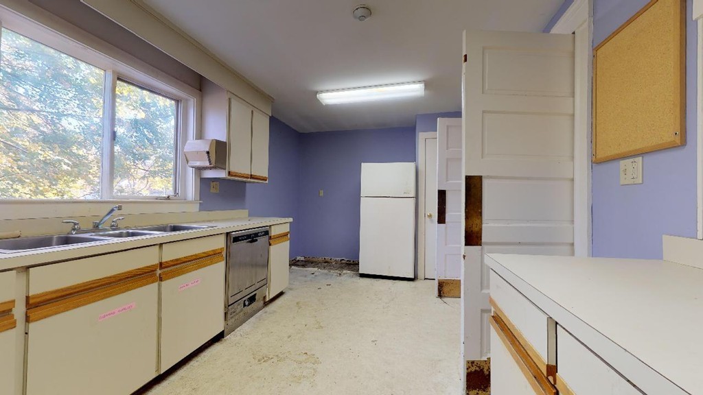 3 Great Pond Road North Andover, MA 01845 - Photo 7 of 14 a kitchen with a sink stove and refrigerator