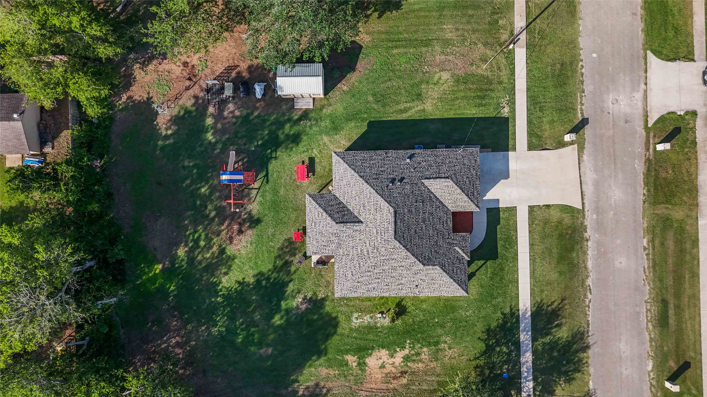 285 Hummingbird Way Martindale, TX 78655 - Photo 39 of 40 an aerial view of a house with a yard basket ball court and outdoor seating
