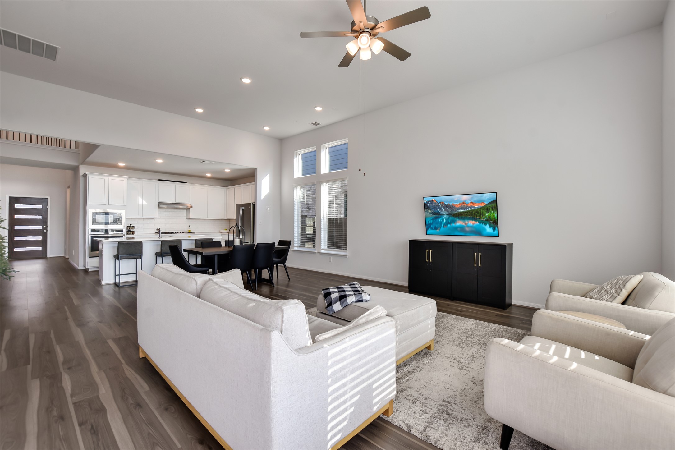 605 Oleander Loop Buda, TX 78610 - Photo 10 of 32 a living room with furniture and wooden floor