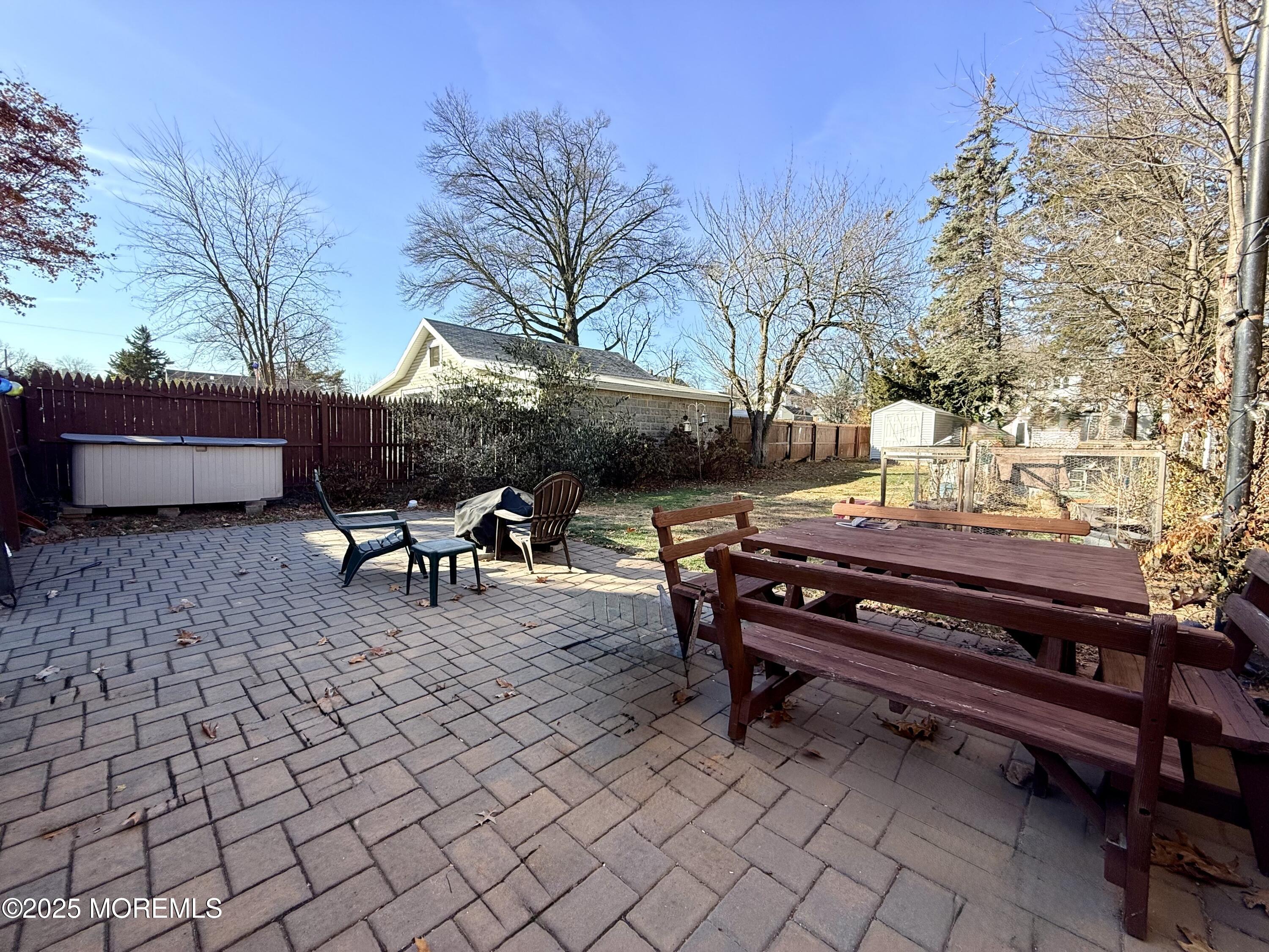48 Broughton Avenue Bloomfield, NJ 07003 - Photo 24 of 27 a backyard of a house with table and chairs
