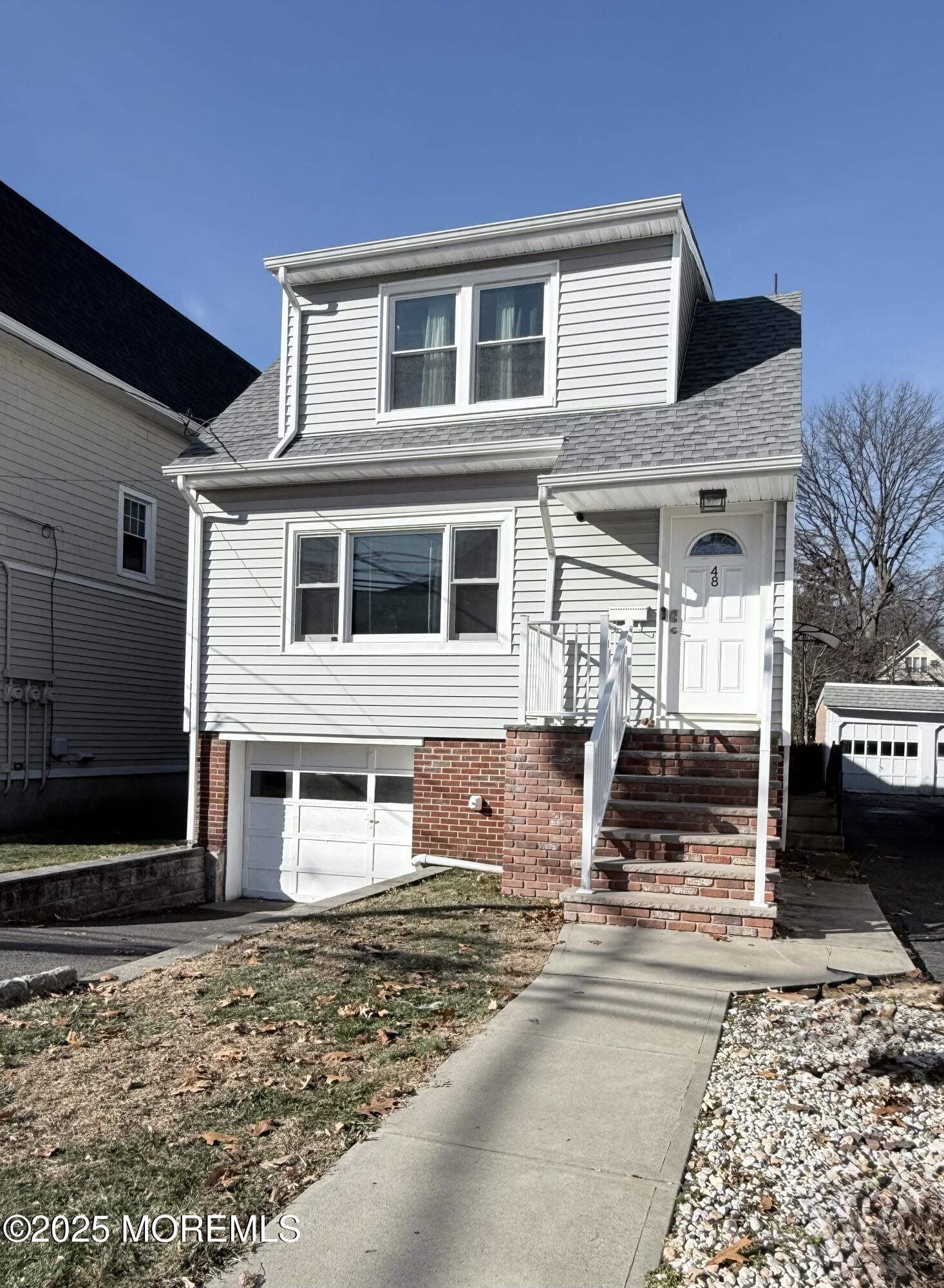 48 Broughton Avenue Bloomfield, NJ 07003 - Photo 27 of 27 a front view of a house with a garden