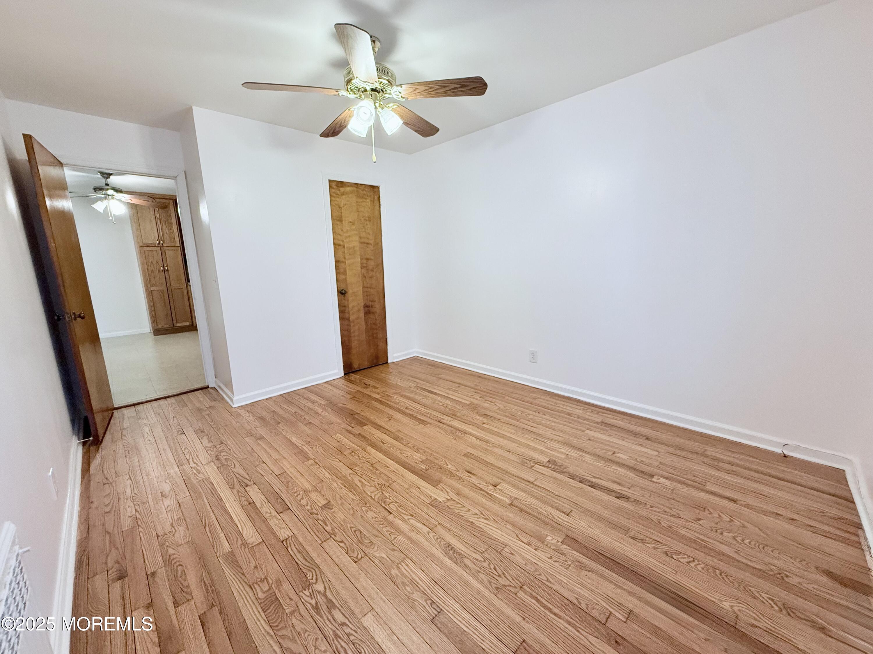 48 Broughton Avenue Bloomfield, NJ 07003 - Photo 7 of 27 a view of empty room with wooden floor