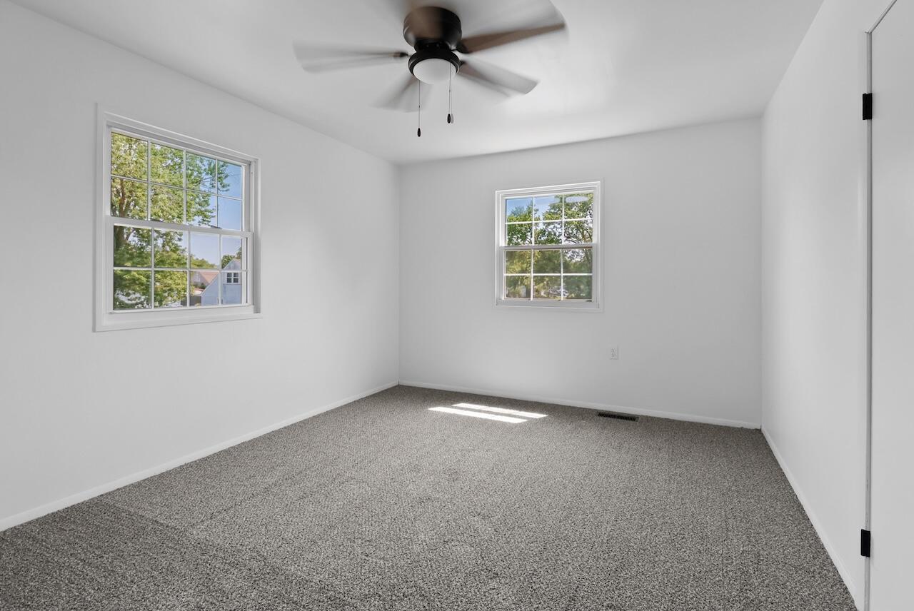 750 Fremont Road Valparaiso, IN 46385 - Photo 18 of 25 an empty room with windows and fan