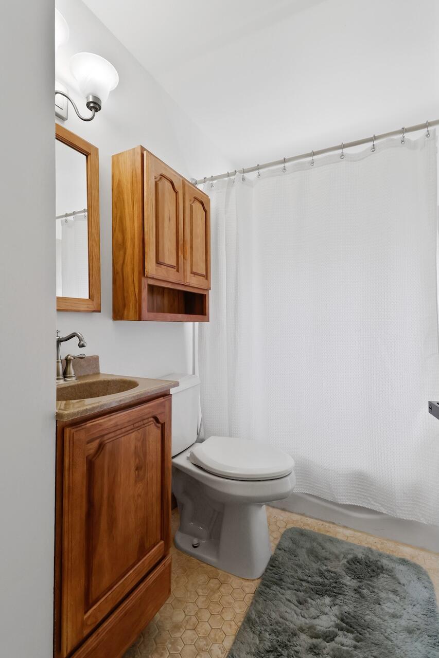 750 Fremont Road Valparaiso, IN 46385 - Photo 20 of 25 a bathroom with a sink a toilet and vanity
