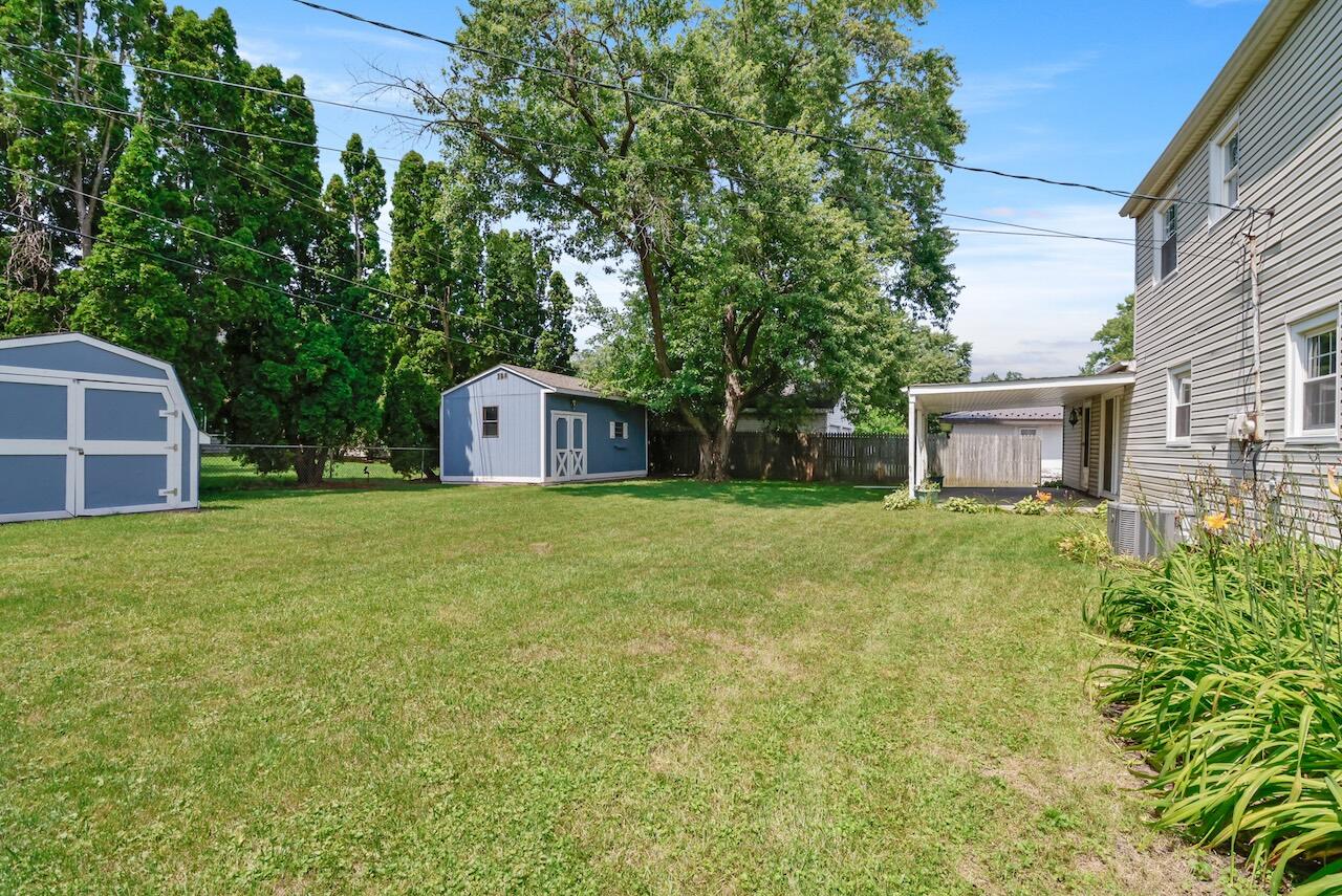 750 Fremont Road Valparaiso, IN 46385 - Photo 23 of 25 a front view of a house with a yard and garage