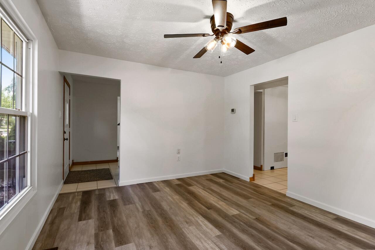 750 Fremont Road Valparaiso, IN 46385 - Photo 4 of 25 wooden floor in an empty room with a window