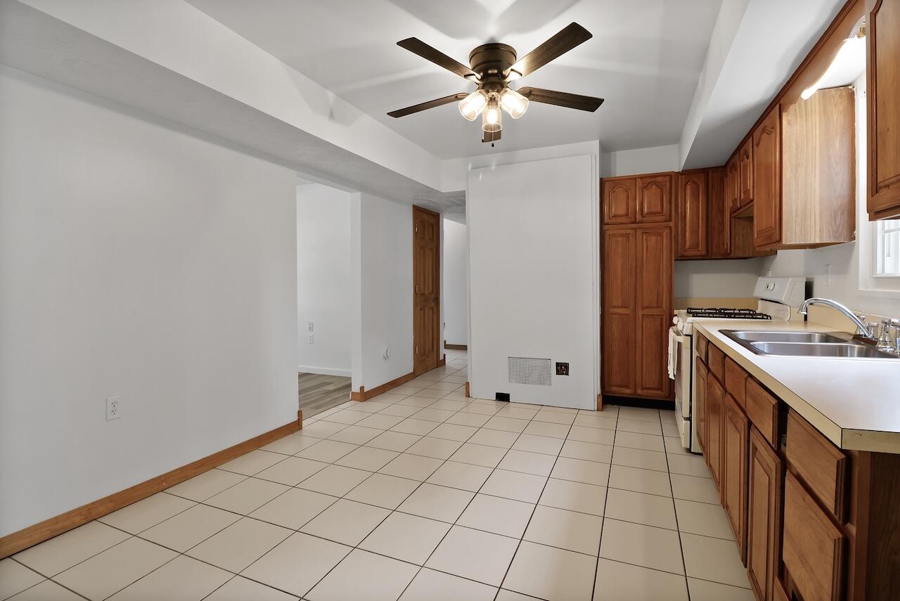 750 Fremont Road Valparaiso, IN 46385 - Photo 9 of 25 a view of a kitchen with a sink and a refrigerator