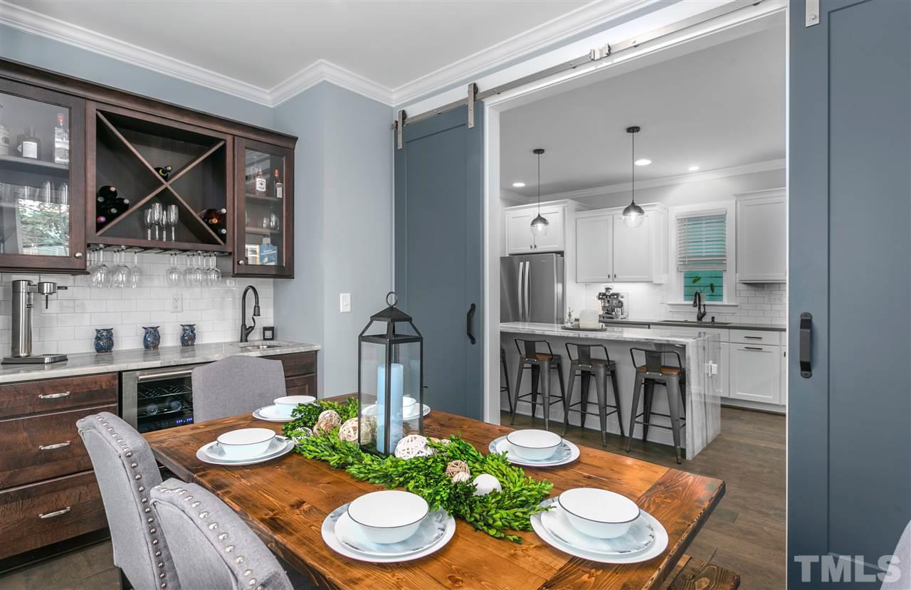 12 Hill Street Raleigh, NC 27610 - Photo 12 of 30 a kitchen with a dining table and chairs