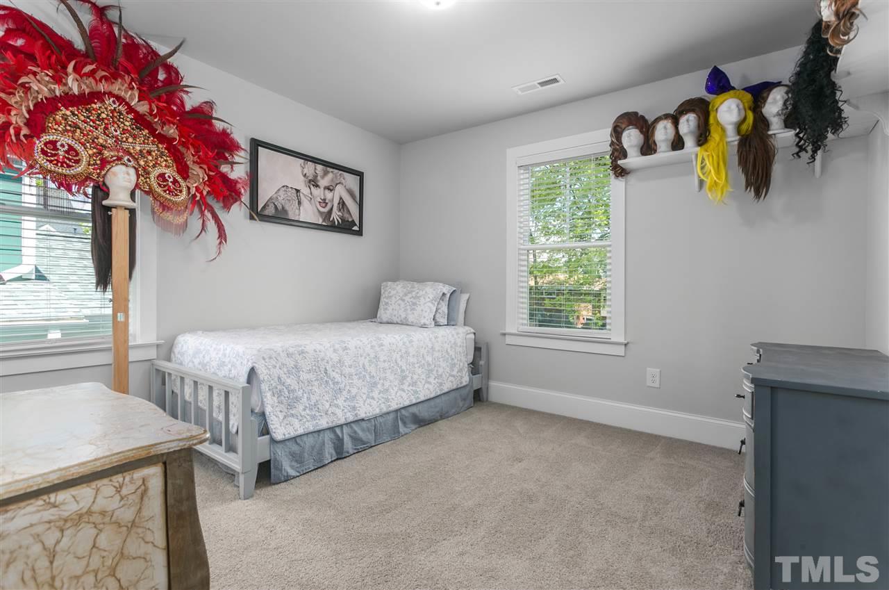 12 Hill Street Raleigh, NC 27610 - Photo 20 of 30 a bedroom with a bed and a window