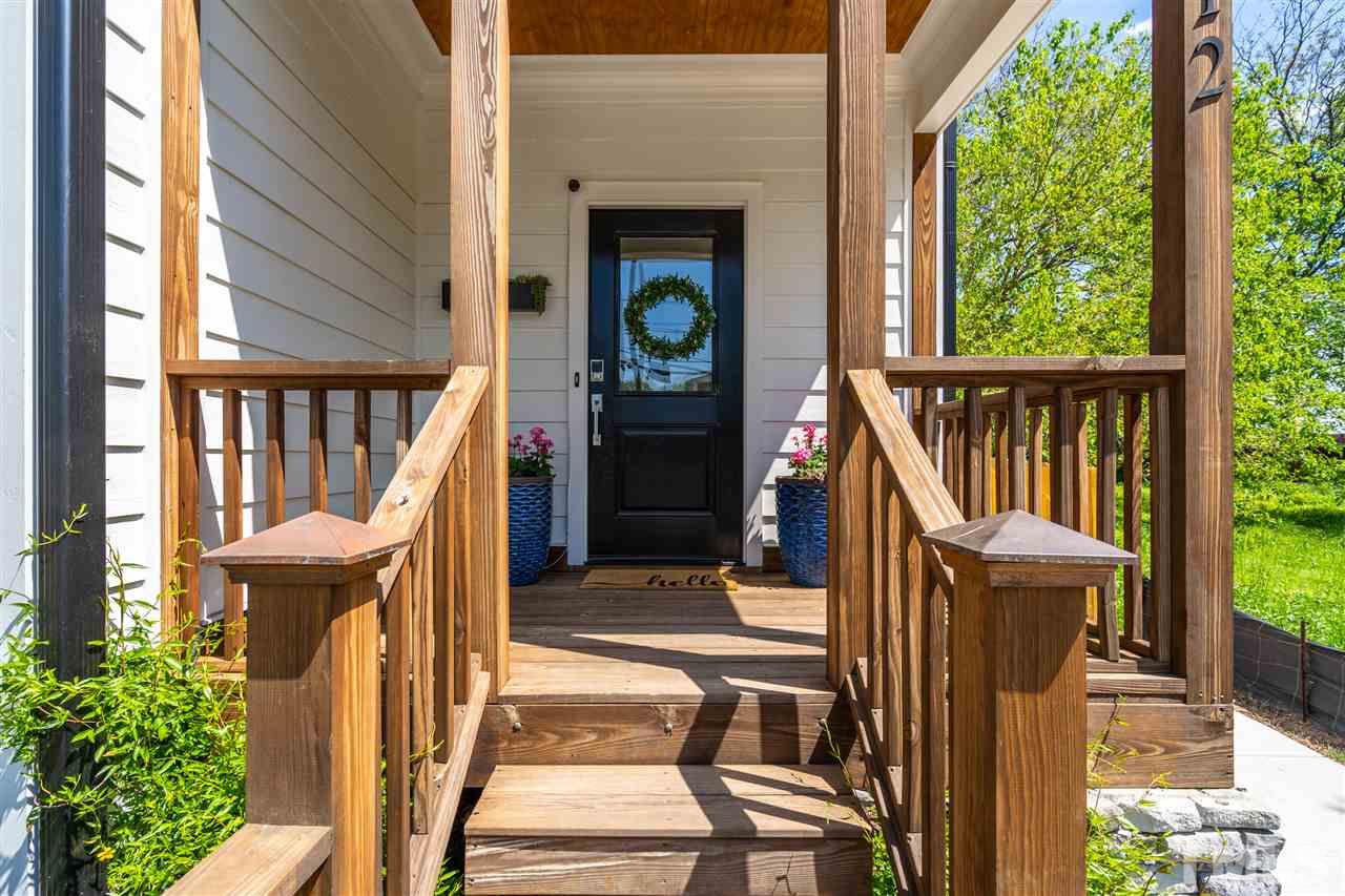 12 Hill Street Raleigh, NC 27610 - Photo 3 of 30 a view of a balcony with wooden floor and furniture