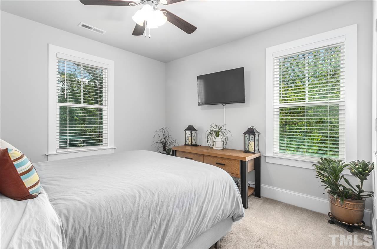12 Hill Street Raleigh, NC 27610 - Photo 21 of 30 a bedroom with a bed and a television